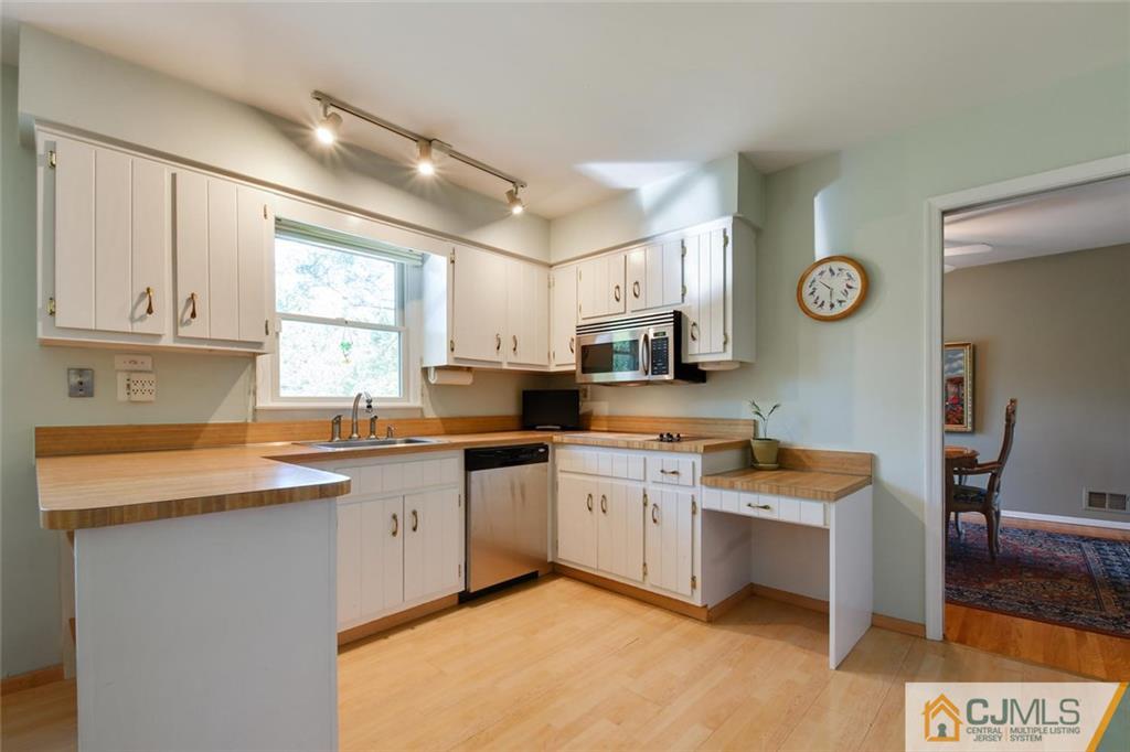 124 Fairfield Road Princeton, NJ 08540 - Photo 10 of 24 a kitchen with stainless steel appliances granite countertop a sink and cabinets