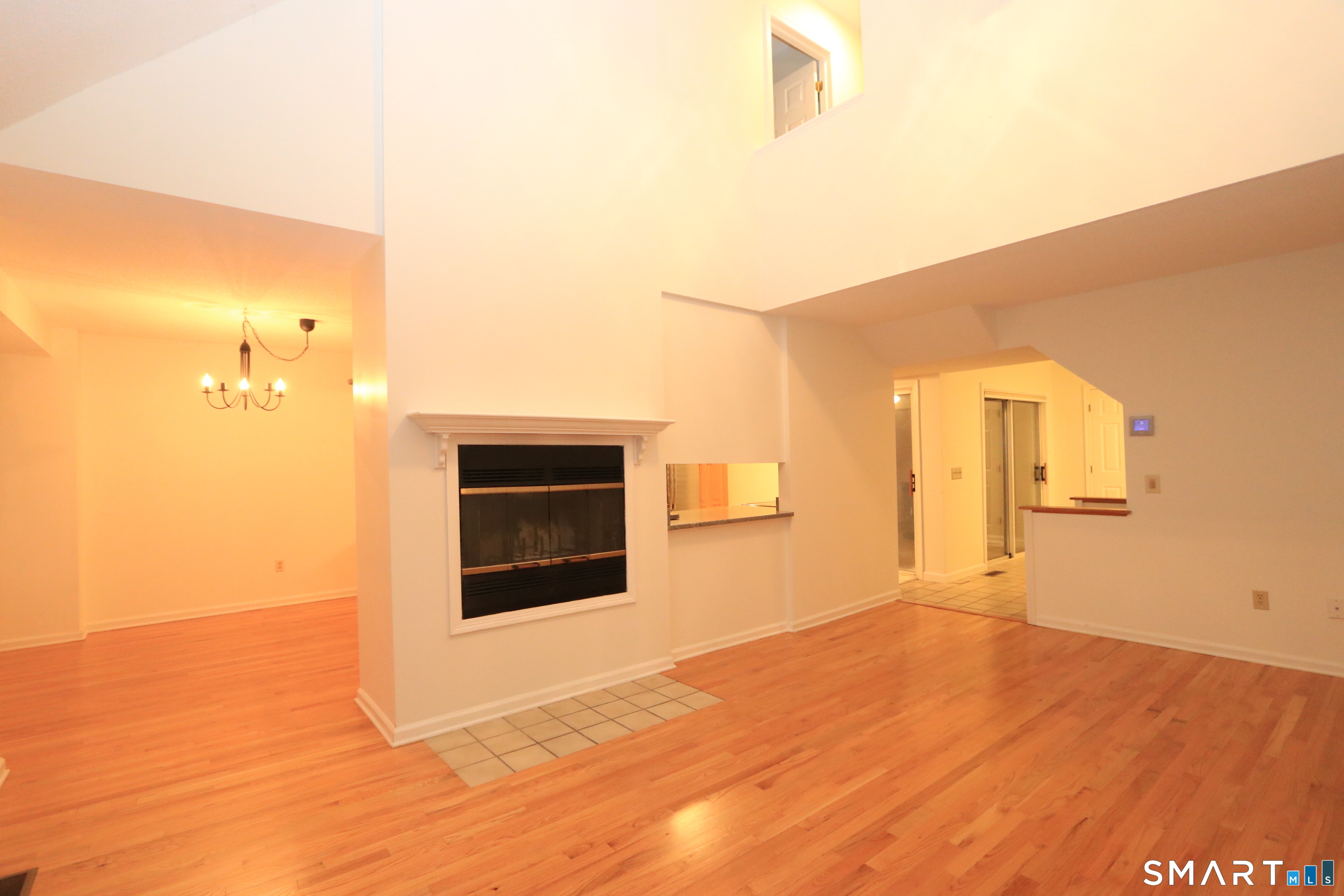 50 Wilton Crest Road, Unit 50 Wilton, CT 06897 - Photo 4 of 31 Living room with fireplace and vaulted ceiling