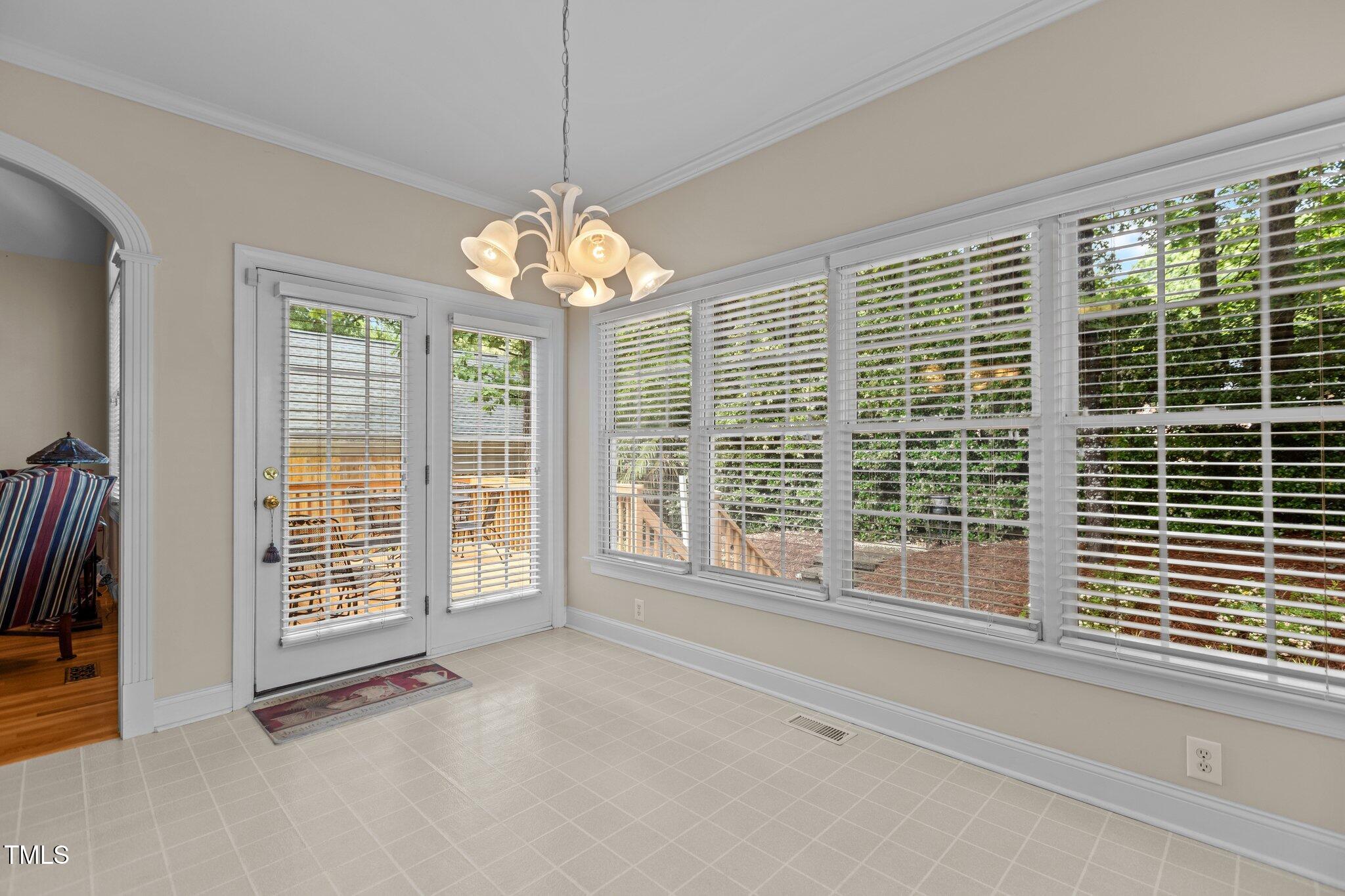 1224 Wedgeland Drive Raleigh, NC 27615 - Photo 12 of 36 a view of an empty room with wooden floor and a window