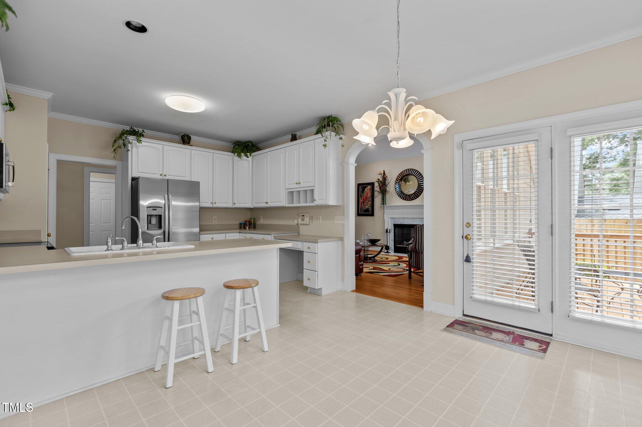 1224 Wedgeland Drive Raleigh, NC 27615 - Photo 13 of 36 a large kitchen with cabinets and stainless steel appliances