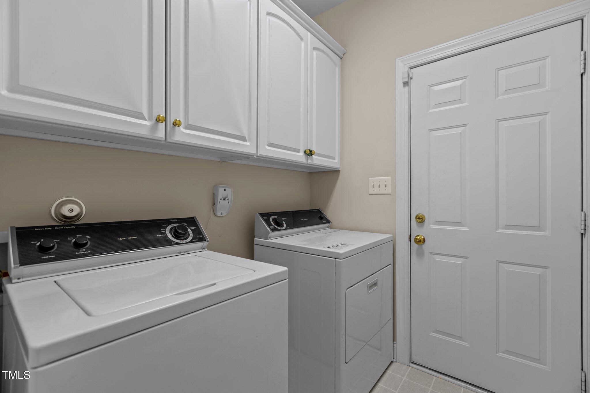 1224 Wedgeland Drive Raleigh, NC 27615 - Photo 18 of 36 a utility room with dryer and washer