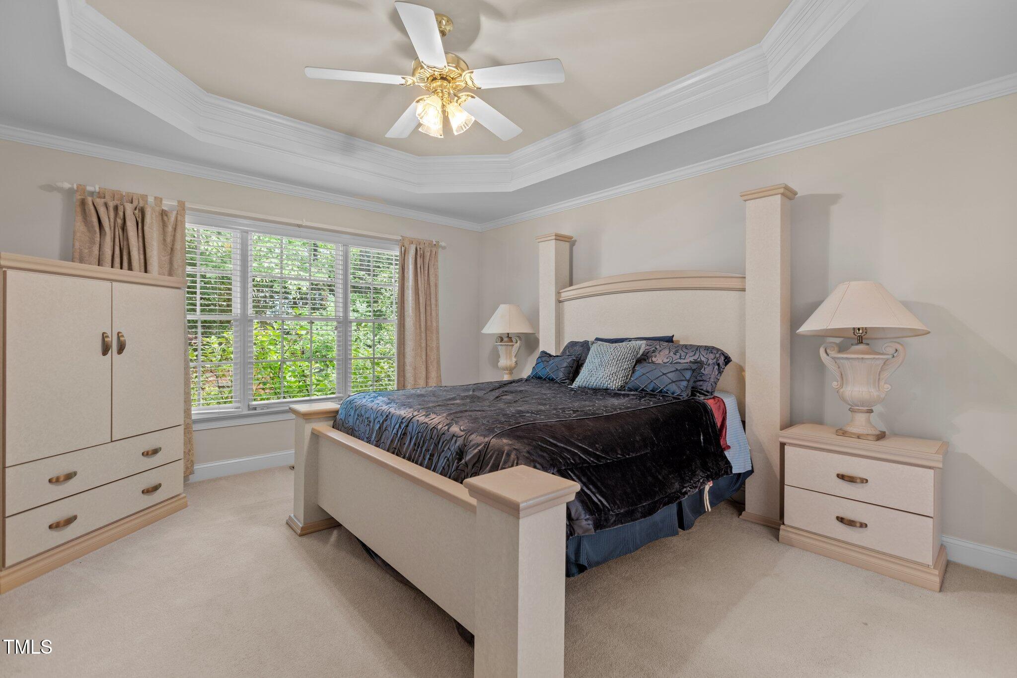 1224 Wedgeland Drive Raleigh, NC 27615 - Photo 19 of 36 a spacious bedroom with a bed and a window