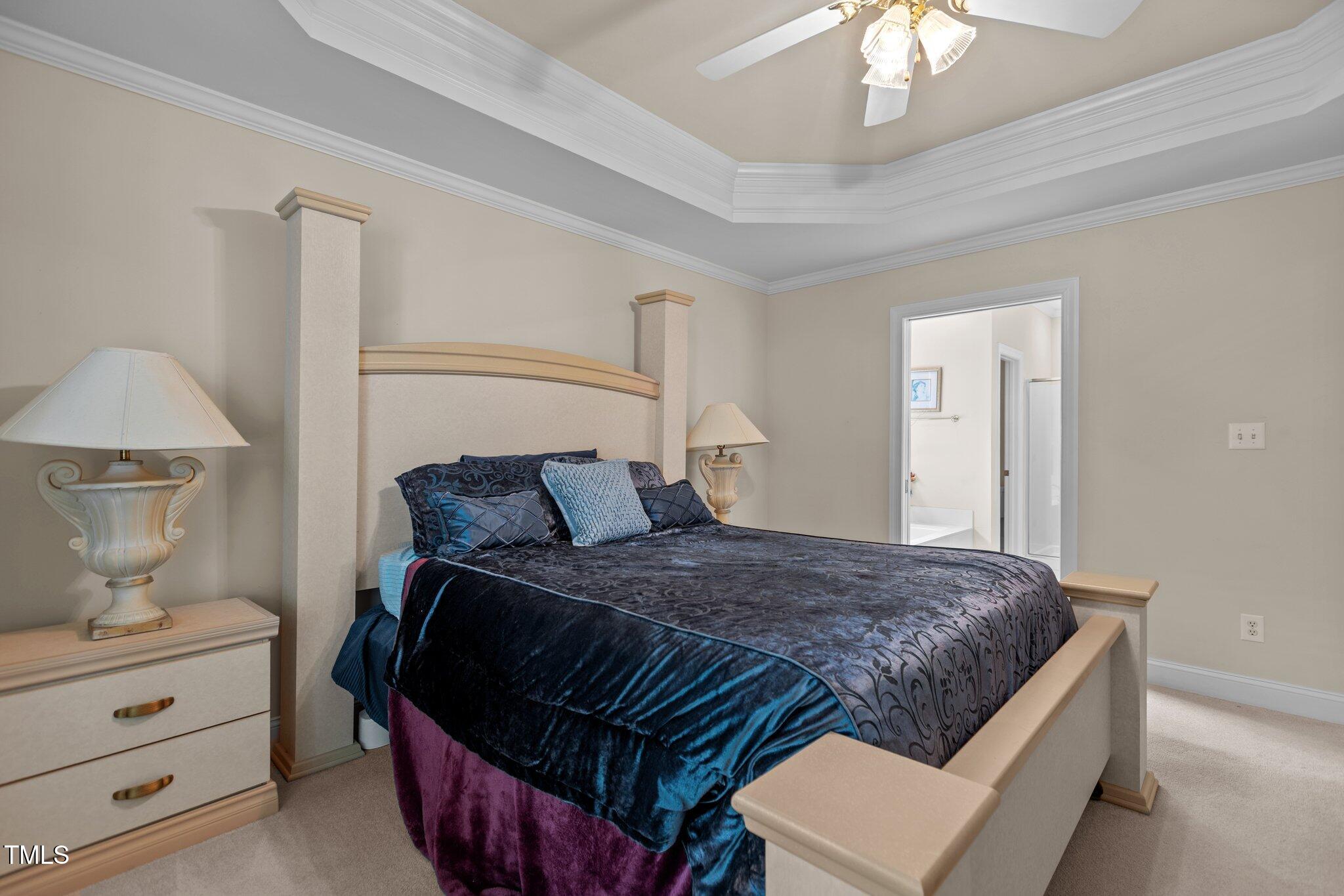 1224 Wedgeland Drive Raleigh, NC 27615 - Photo 20 of 36 a bedroom with a bed and a lamp on table