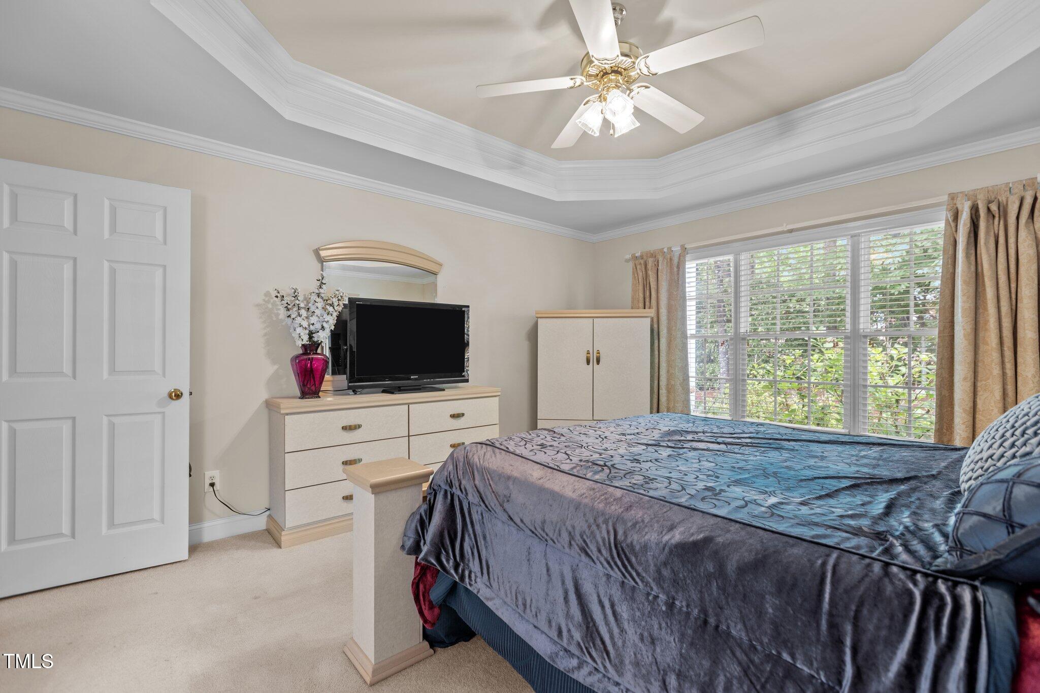 1224 Wedgeland Drive Raleigh, NC 27615 - Photo 21 of 36 a bed room with a bed television and a window