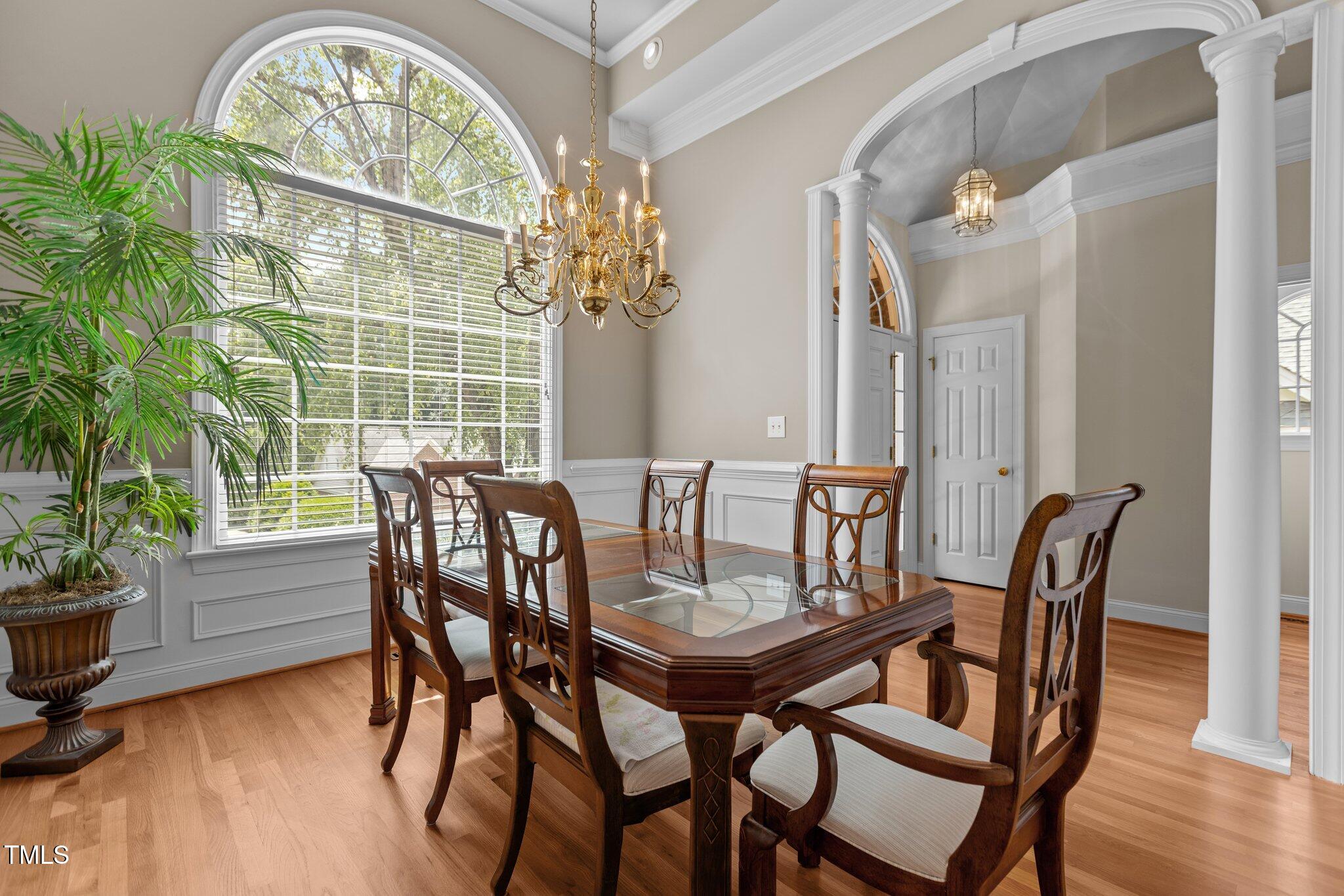1224 Wedgeland Drive Raleigh, NC 27615 - Photo 5 of 36 a view of a dining room with furniture window and wooden floor