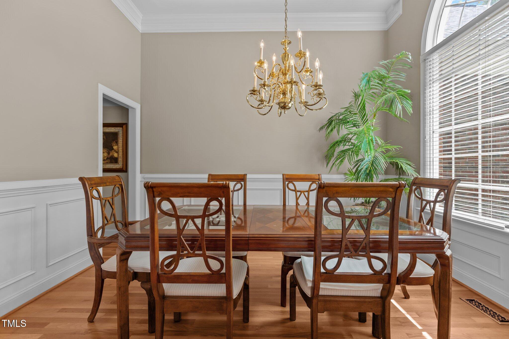 1224 Wedgeland Drive Raleigh, NC 27615 - Photo 6 of 36 a view of a dining room with furniture and chandelier