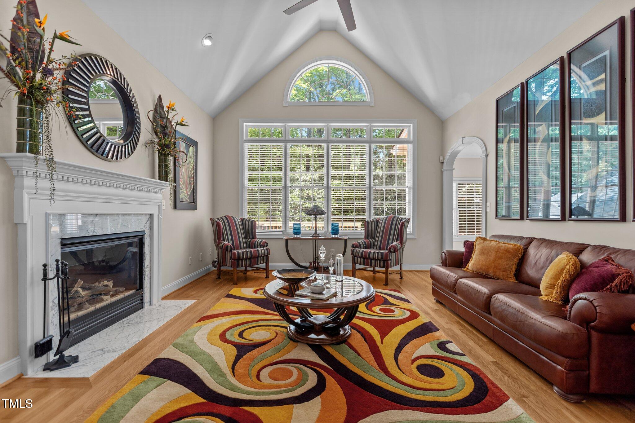 1224 Wedgeland Drive Raleigh, NC 27615 - Photo 7 of 36 a living room with furniture and a fireplace