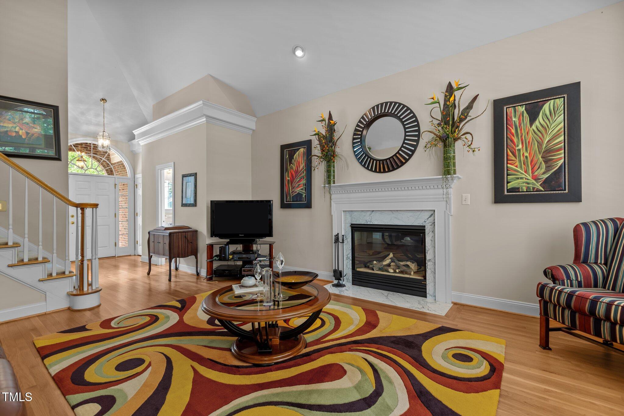 1224 Wedgeland Drive Raleigh, NC 27615 - Photo 8 of 36 a living room with furniture and a fireplace