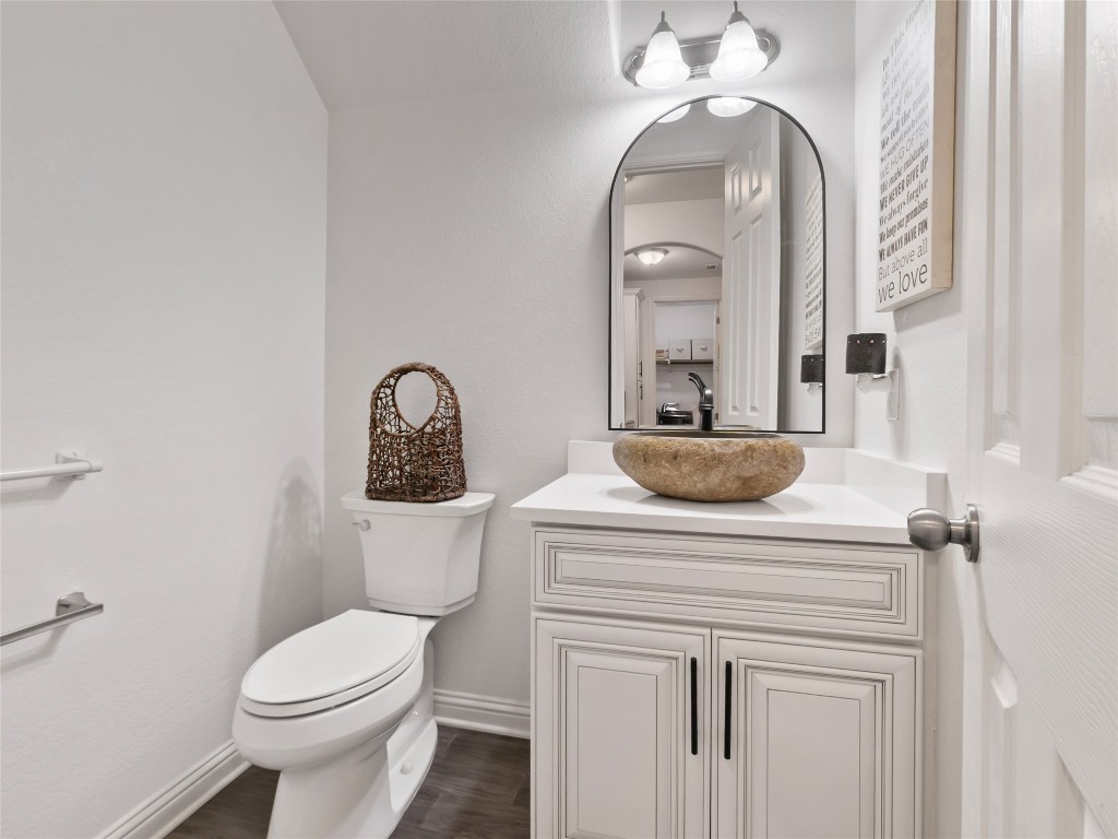 1101 Feather Reed Drive Leander, TX 78641 - Photo 12 of 40 a bathroom with a toilet sink and mirror