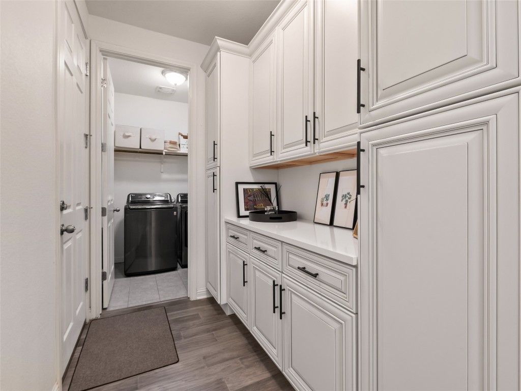 1101 Feather Reed Drive Leander, TX 78641 - Photo 13 of 40 a kitchen with stainless steel appliances granite countertop white cabinets and refrigerator
