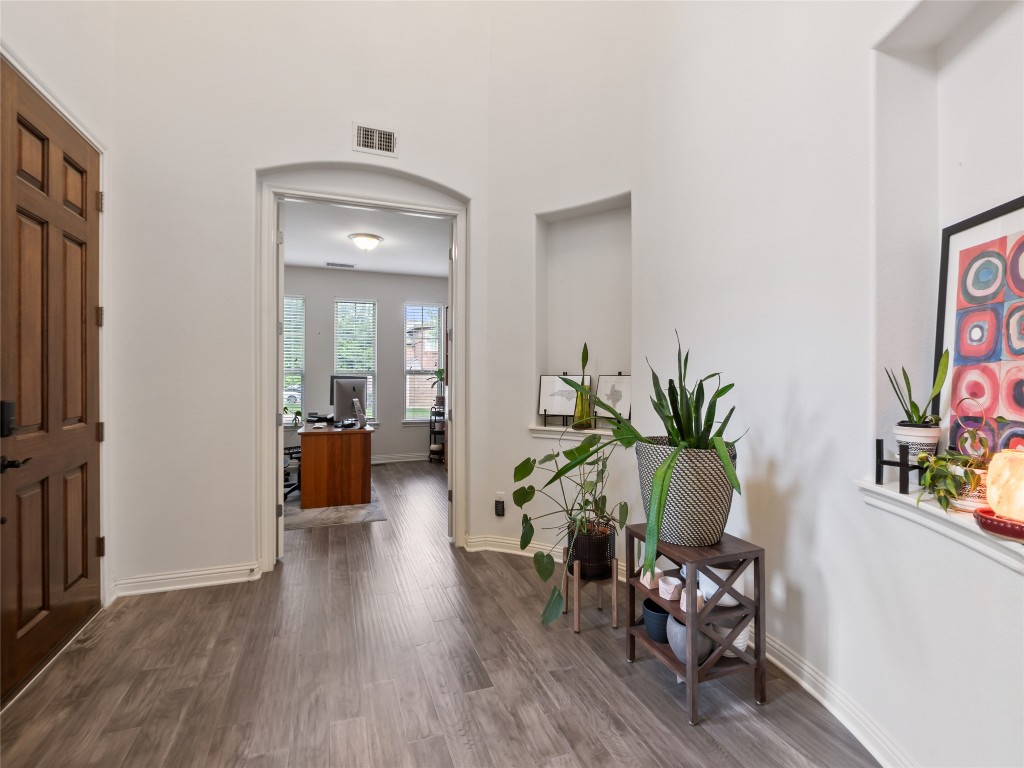 1101 Feather Reed Drive Leander, TX 78641 - Photo 14 of 40 a living room with furniture and a potted plant