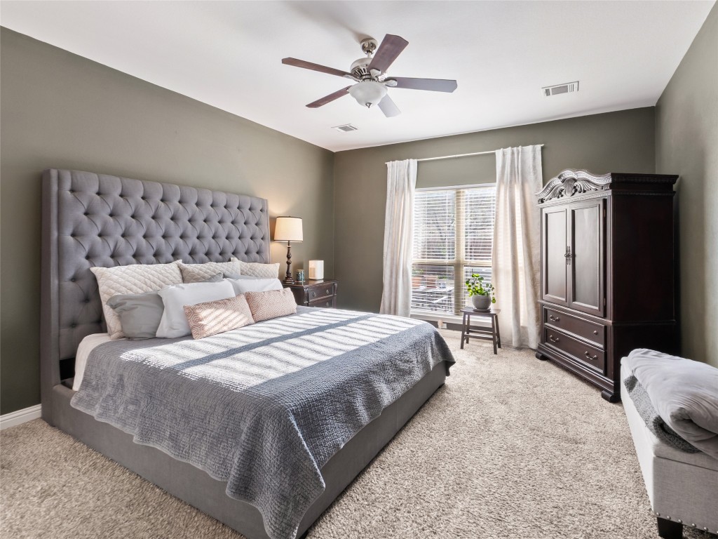 1101 Feather Reed Drive Leander, TX 78641 - Photo 15 of 40 a bedroom with bed and a large window