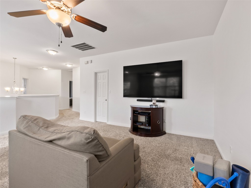1101 Feather Reed Drive Leander, TX 78641 - Photo 19 of 40 a living room with furniture and a flat screen tv