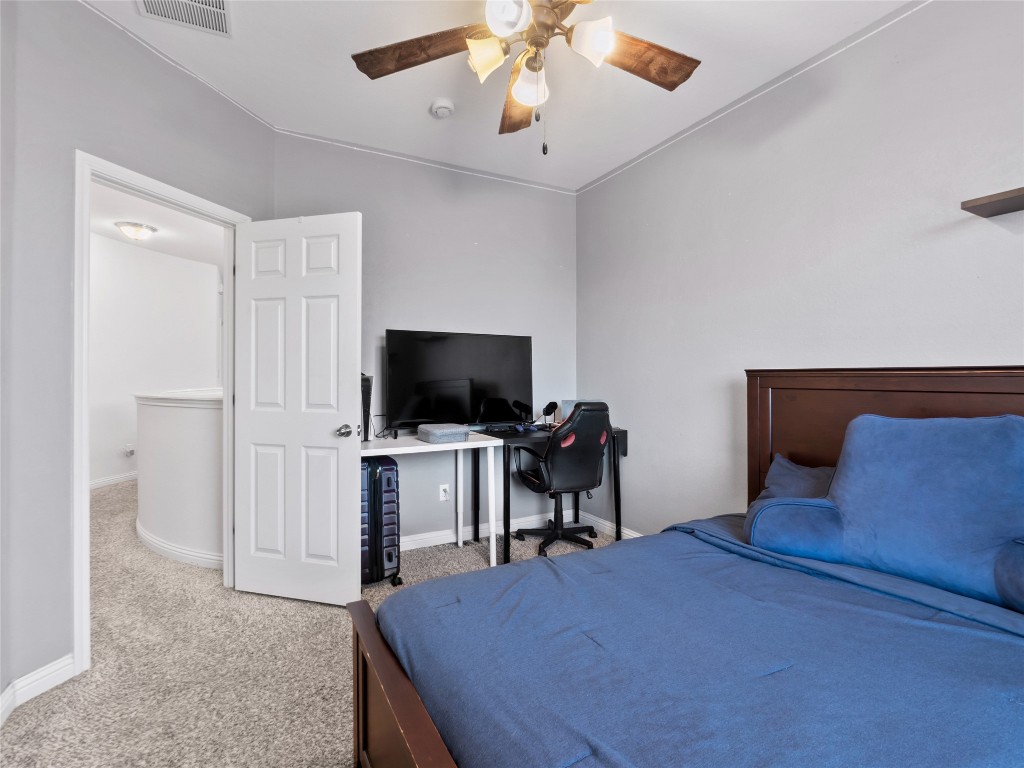 1101 Feather Reed Drive Leander, TX 78641 - Photo 20 of 40 a bedroom with a bed and a flat screen tv