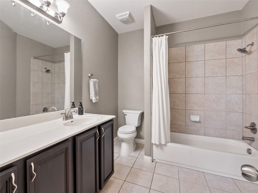 1101 Feather Reed Drive Leander, TX 78641 - Photo 24 of 40 a bathroom with a double vanity sink toilet and shower