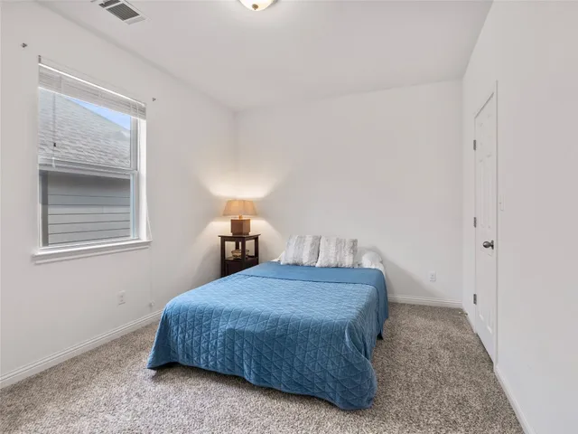 a bathroom with a double vanity sink toilet and shower