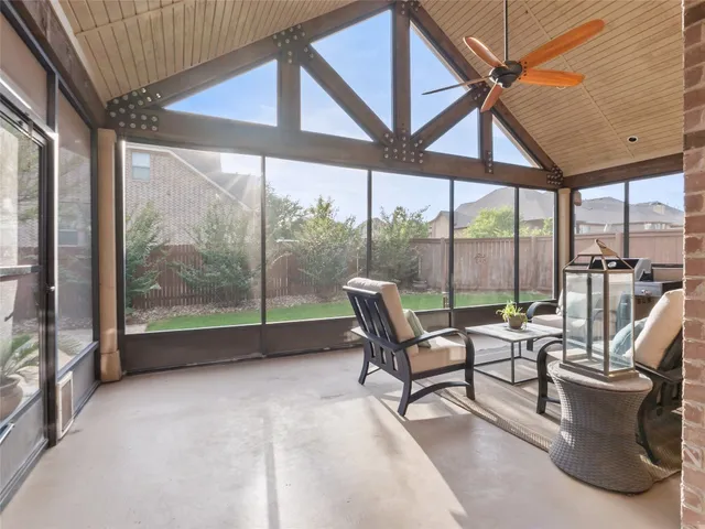 a bedroom with a bed and flowerpot