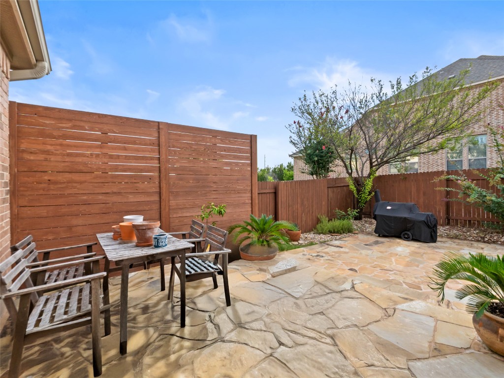 1101 Feather Reed Drive Leander, TX 78641 - Photo 27 of 40 a backyard of a house with outdoor seating