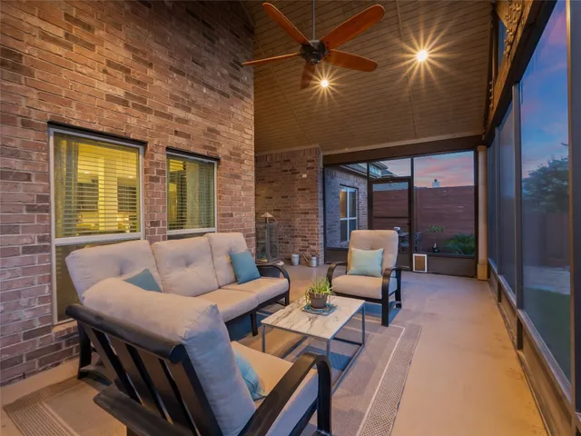 a outdoor living space with furniture and a fireplace