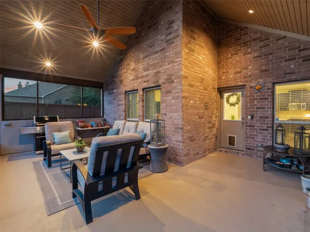 a view of a two chairs in the balcony