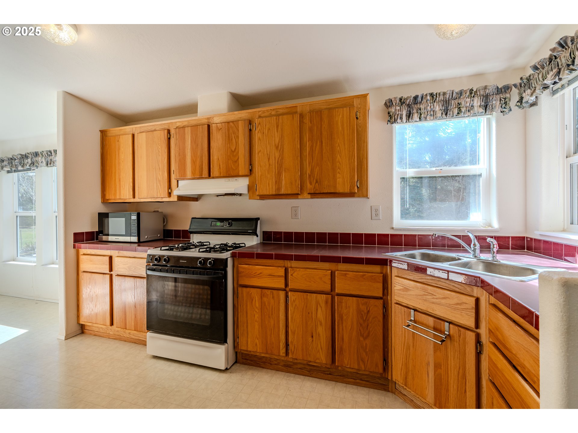 41300 Southeast Louden Road Corbett, OR 97019 - Photo 14 of 48 a kitchen with stainless steel appliances granite countertop a sink stove and refrigerator