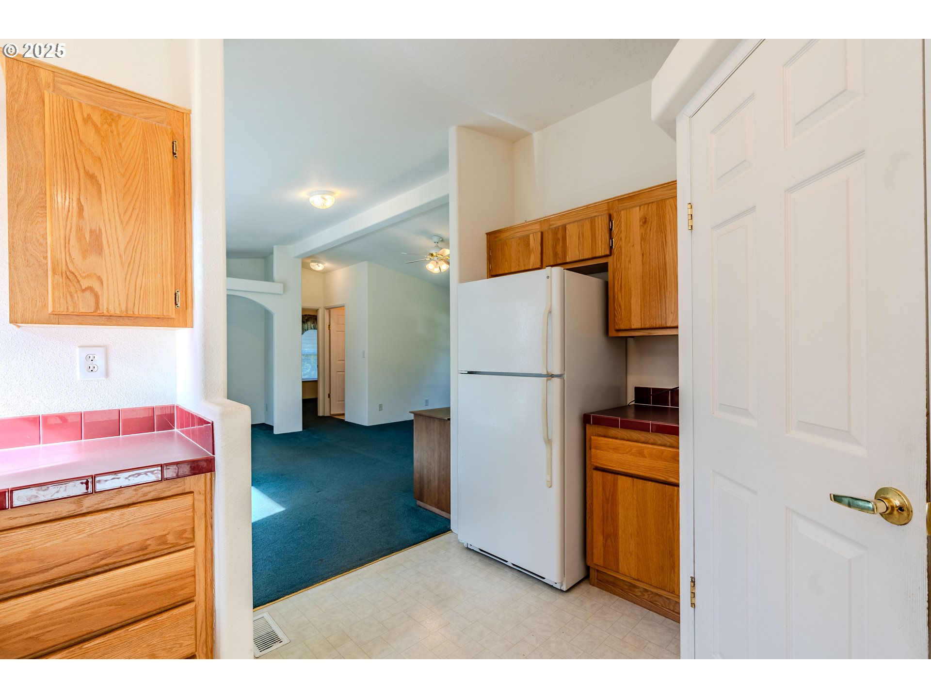 41300 Southeast Louden Road Corbett, OR 97019 - Photo 15 of 48 a kitchen with refrigerator and cabinets