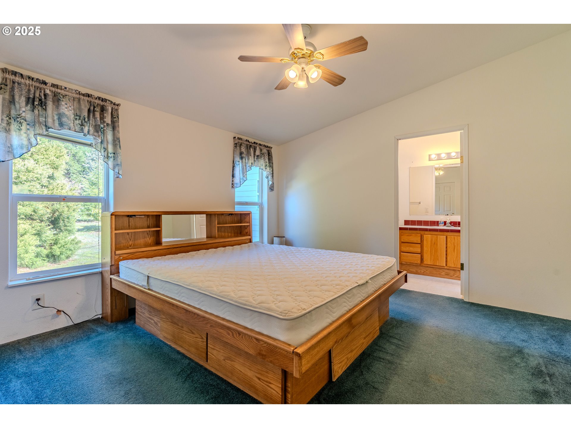 41300 Southeast Louden Road Corbett, OR 97019 - Photo 18 of 48 a bedroom with a bed and a window