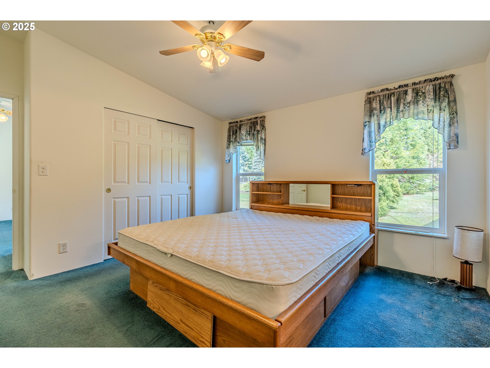 41300 Southeast Louden Road Corbett, OR 97019 - Photo 19 of 48 a bed sitting in a spacious bedroom next to a window
