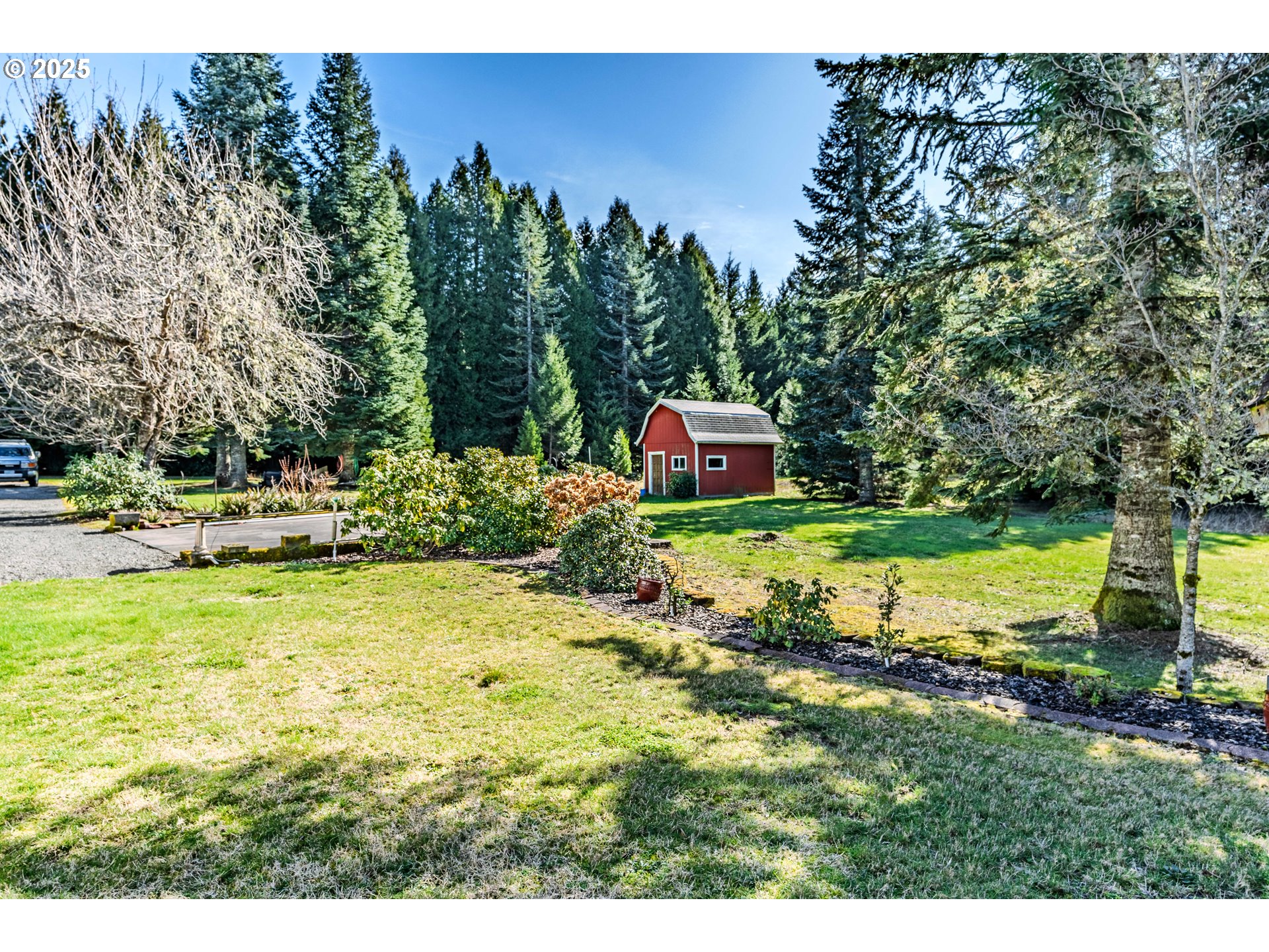 41300 Southeast Louden Road Corbett, OR 97019 - Photo 29 of 48 a backyard of a house with a yard and outdoor seating