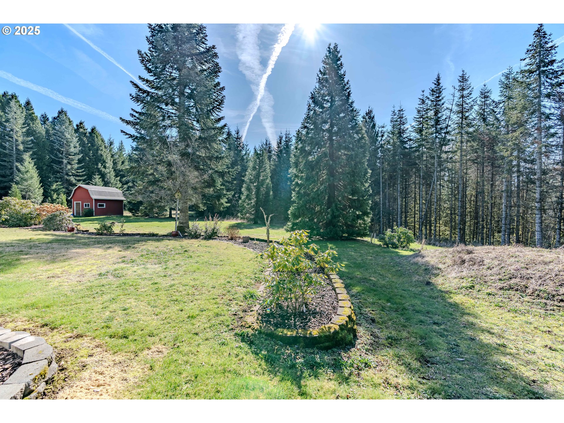 41300 Southeast Louden Road Corbett, OR 97019 - Photo 42 of 48 a view of a swimming pool with a bench and trees in the background