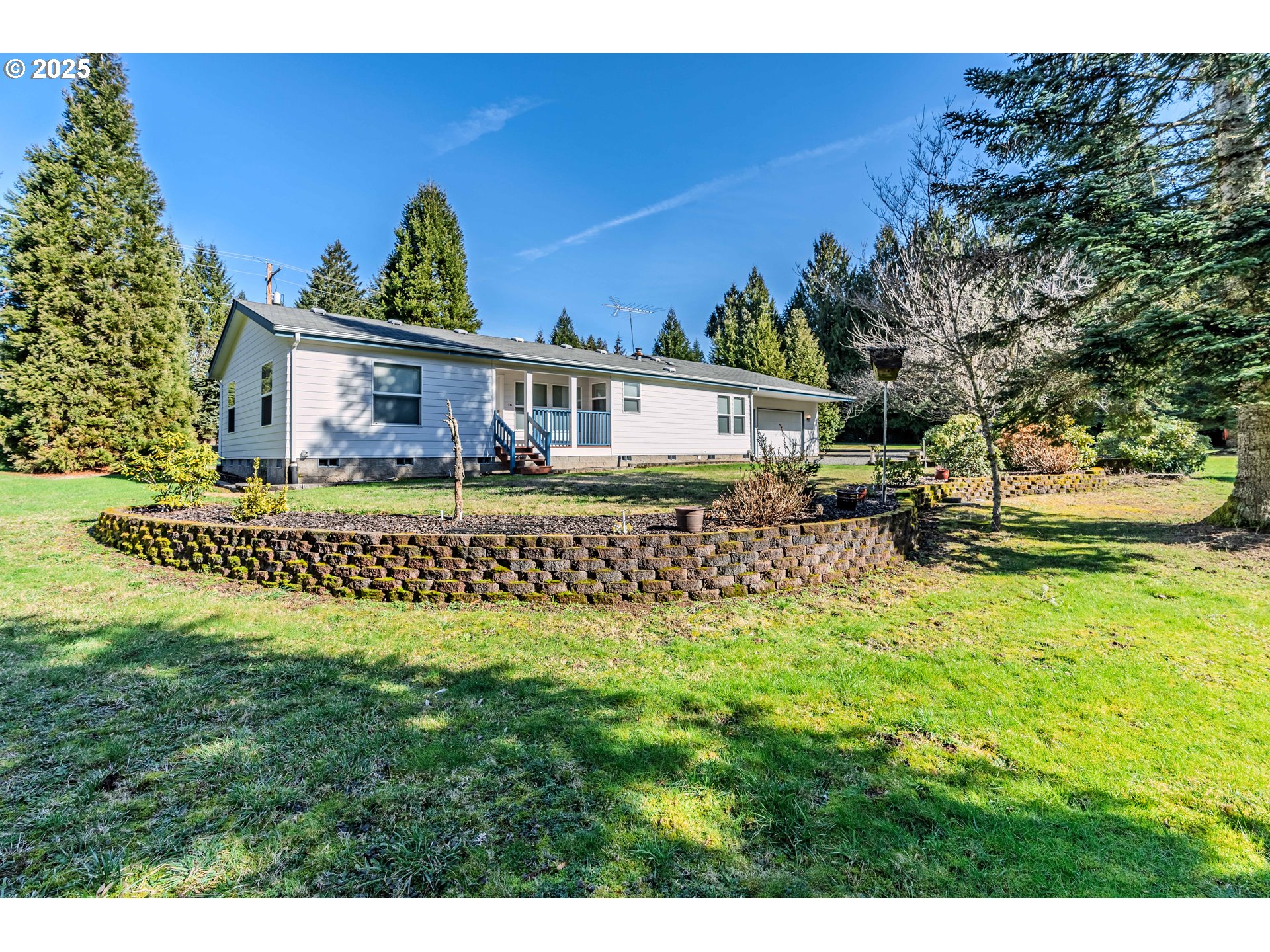 41300 Southeast Louden Road Corbett, OR 97019 - Photo 6 of 48 a front view of a house with a garden