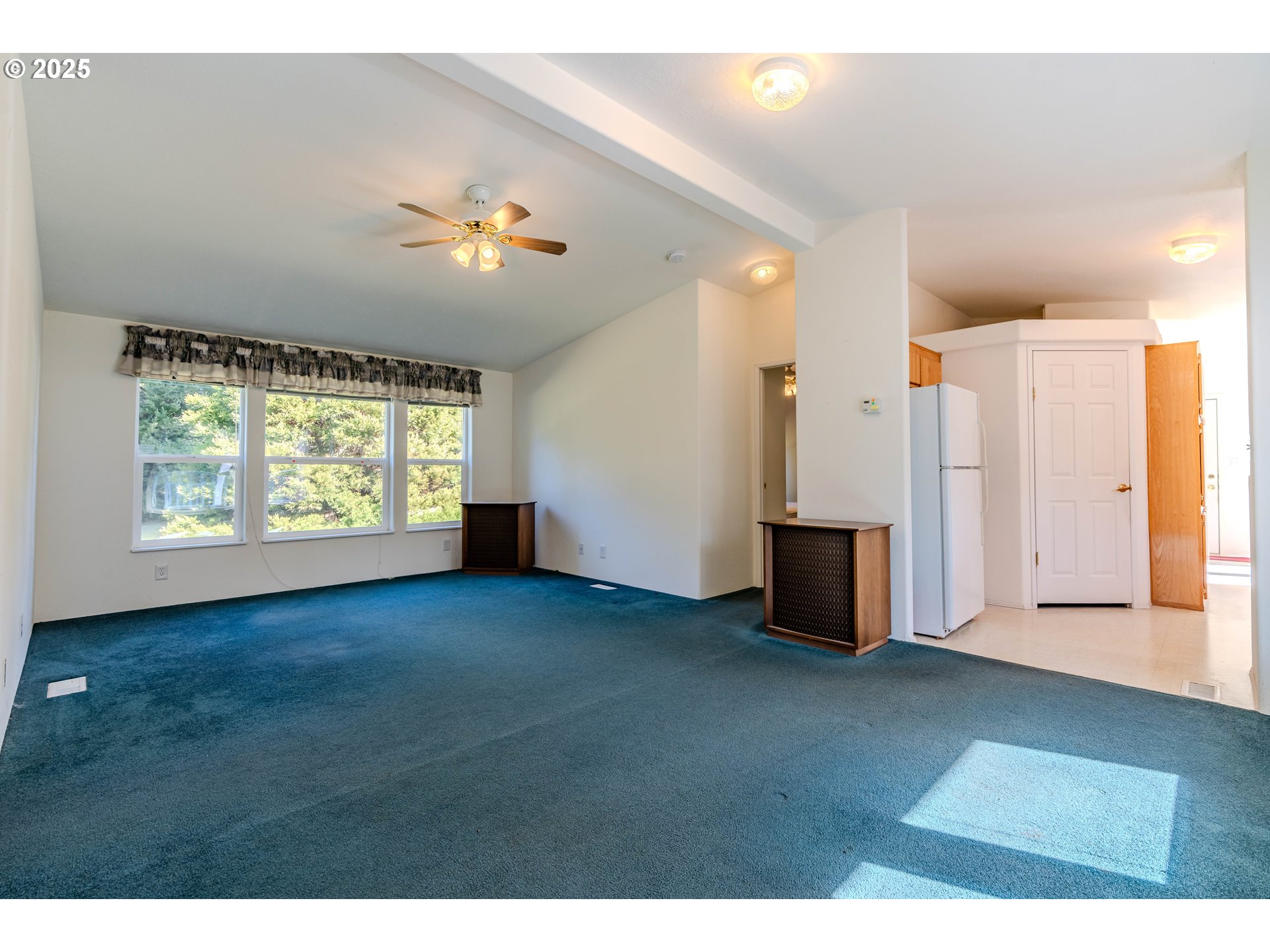 41300 Southeast Louden Road Corbett, OR 97019 - Photo 10 of 48 a view of a livingroom with a ceiling fan and window