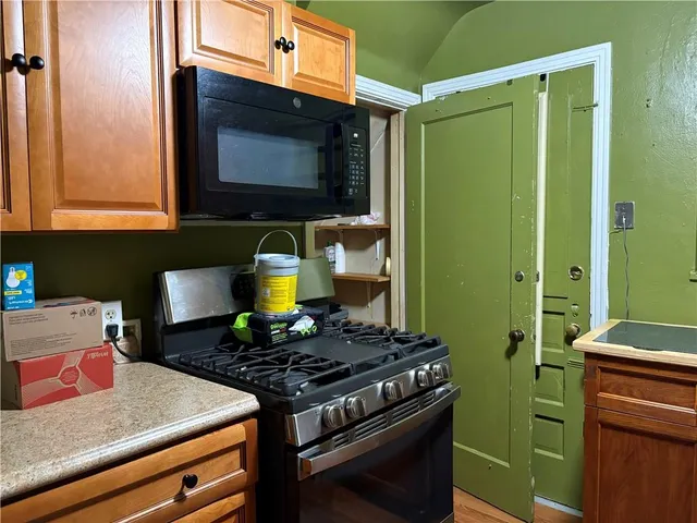 a kitchen with a stove and a microwave