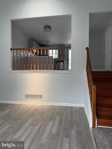 wooden floor in a hall with an entryway