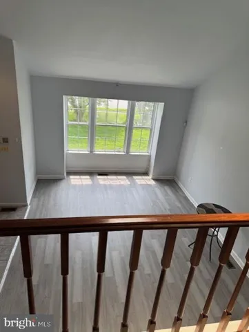 a view of wooden floor with a window