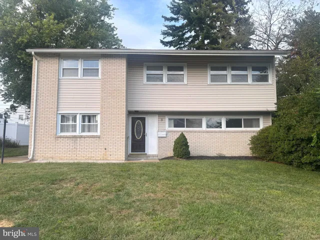 a house that has a big yard in front of it