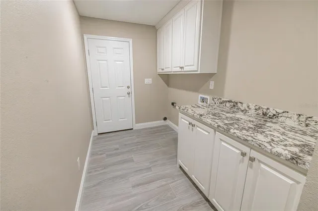 a view of a kitchen from the hallway