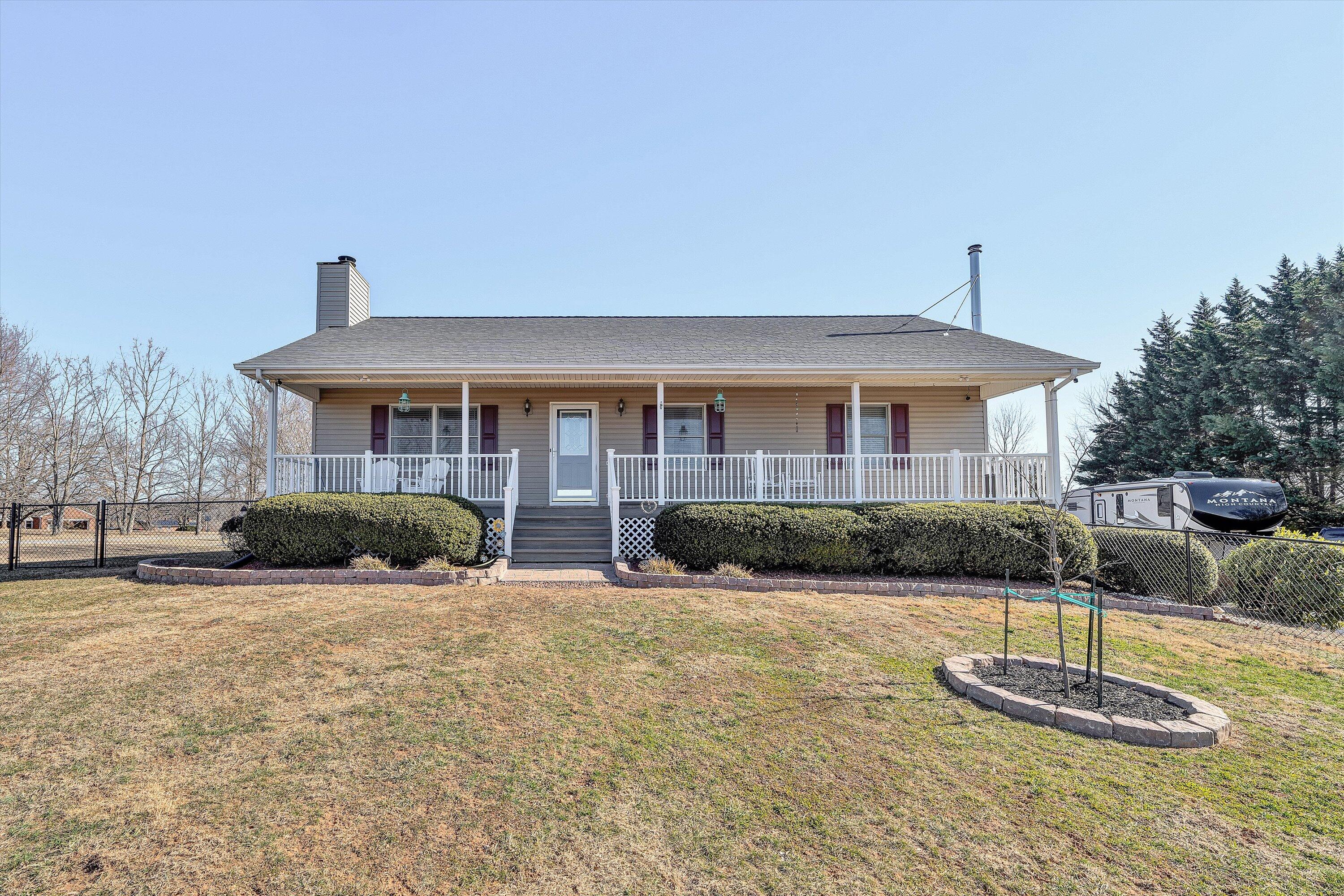 1160 Sandy Level Road Goodview, VA 24095 - Photo 2 of 47 a front view of a house with a yard
