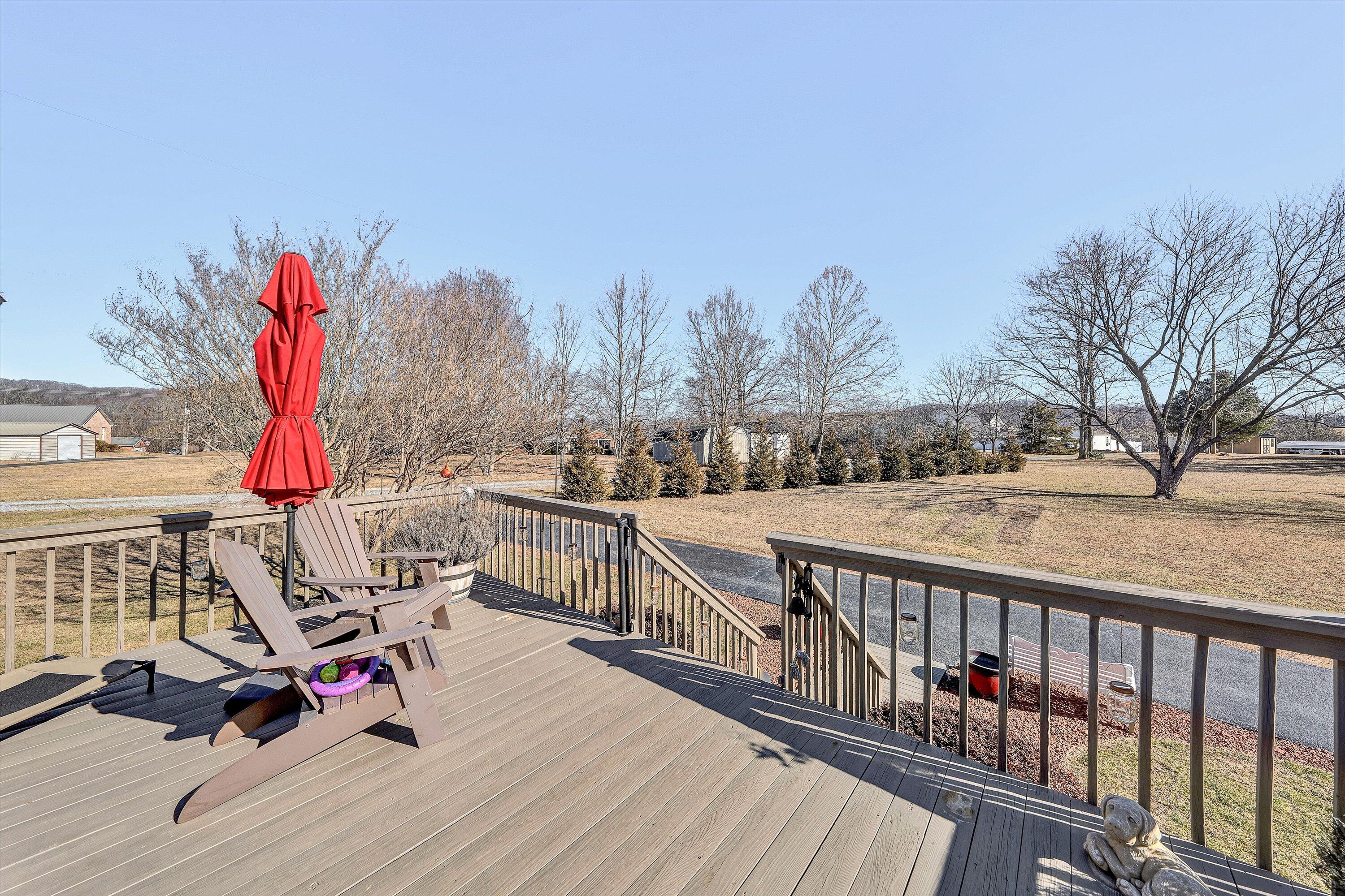 1160 Sandy Level Road Goodview, VA 24095 - Photo 23 of 47 a view of roof deck with wooden floor and fence