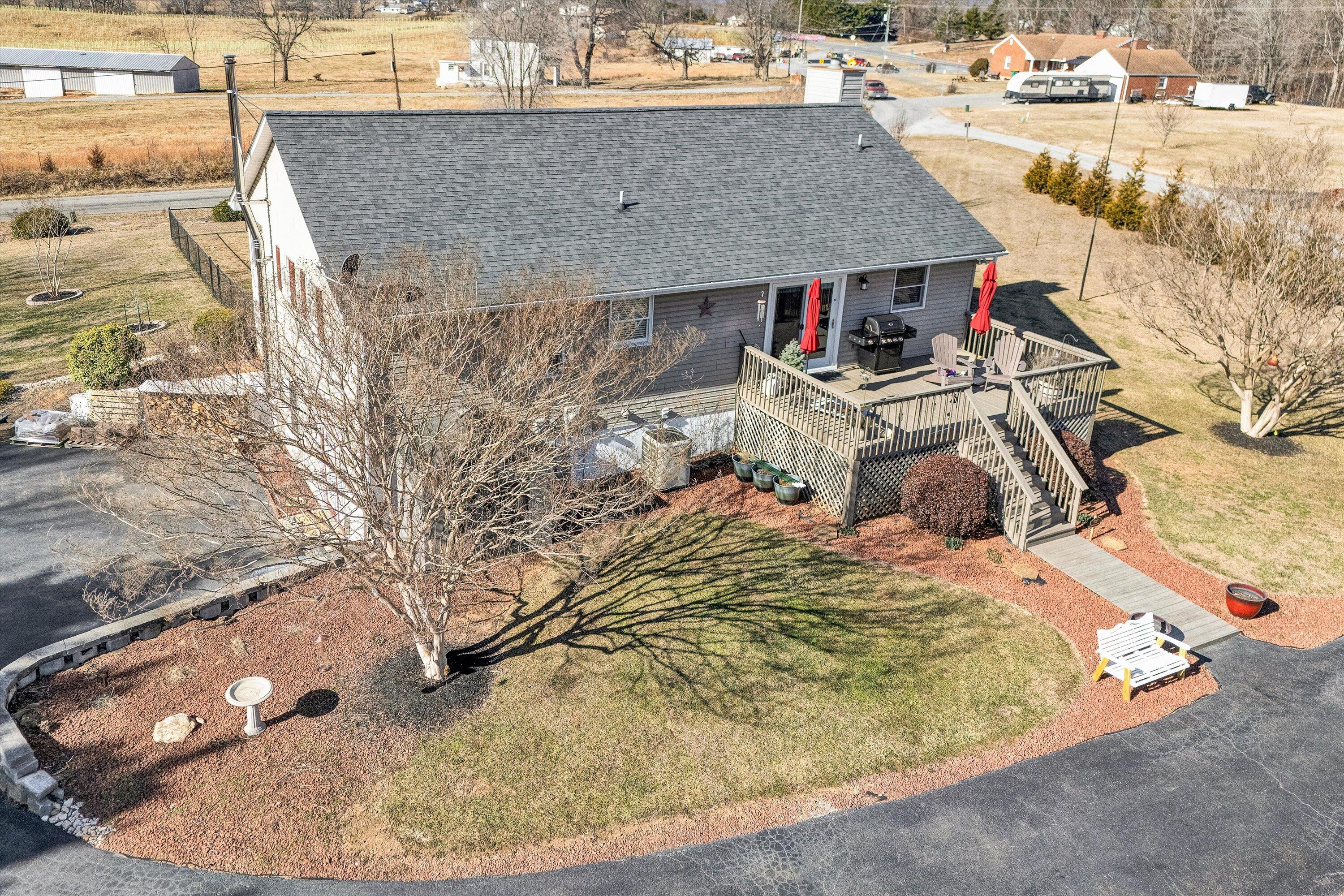 1160 Sandy Level Road Goodview, VA 24095 - Photo 25 of 47 an aerial view of a house with a yard and sitting area
