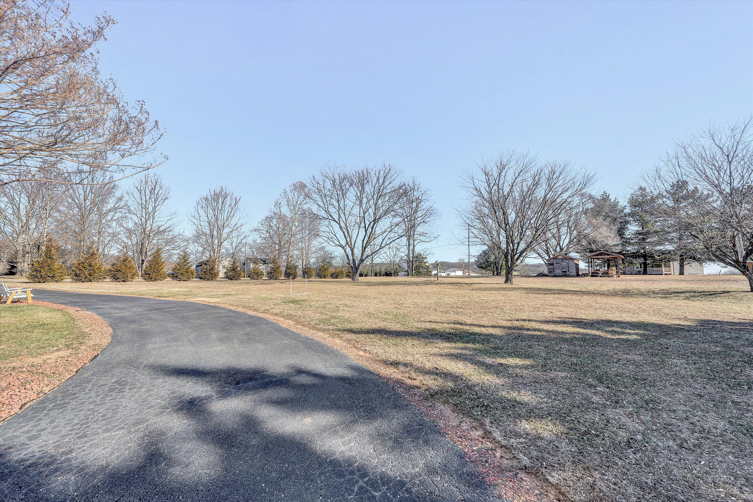 1160 Sandy Level Road Goodview, VA 24095 - Photo 27 of 47 a view of road view with large trees