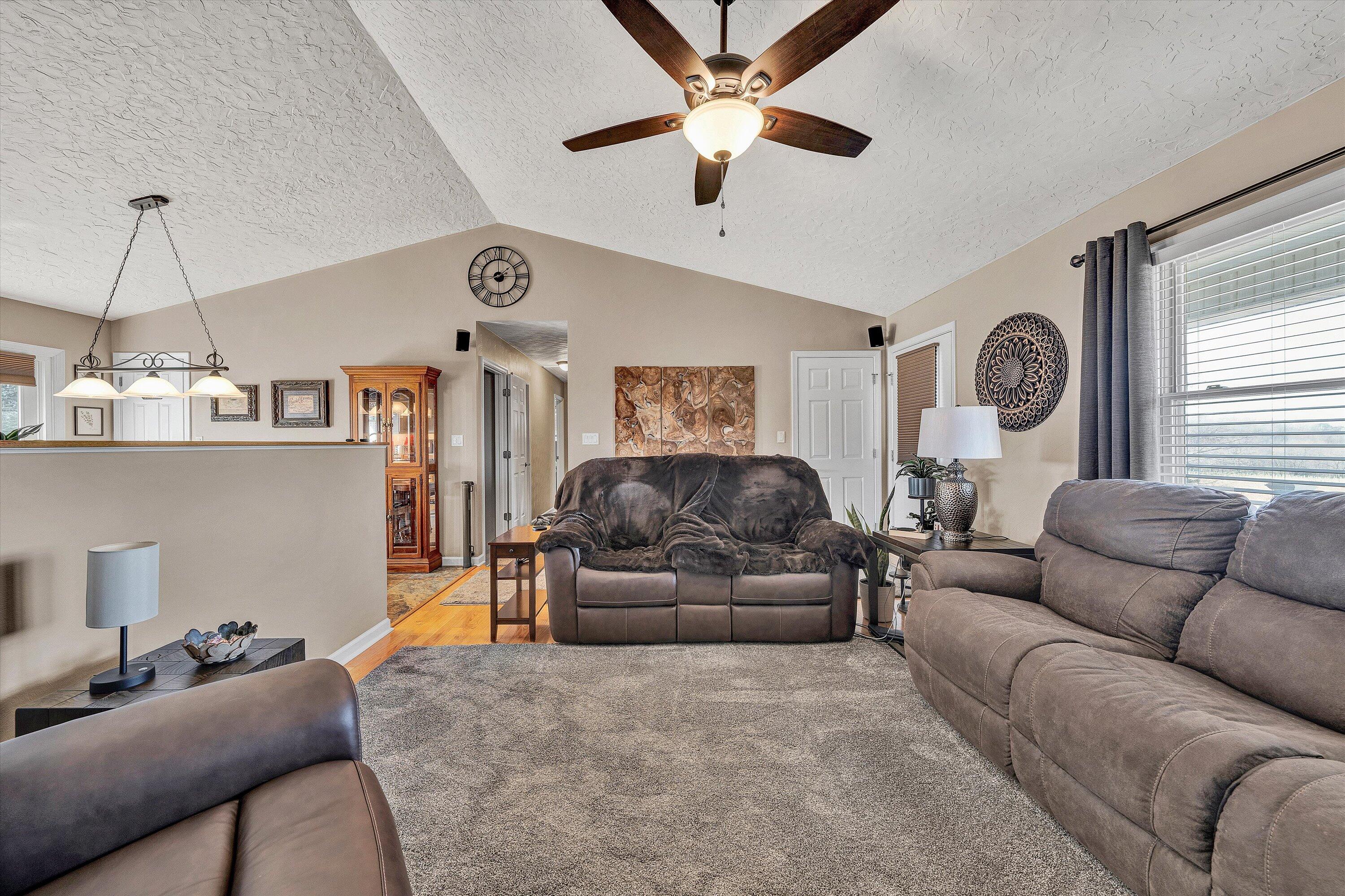 1160 Sandy Level Road Goodview, VA 24095 - Photo 4 of 47 a living room with furniture and a chandelier
