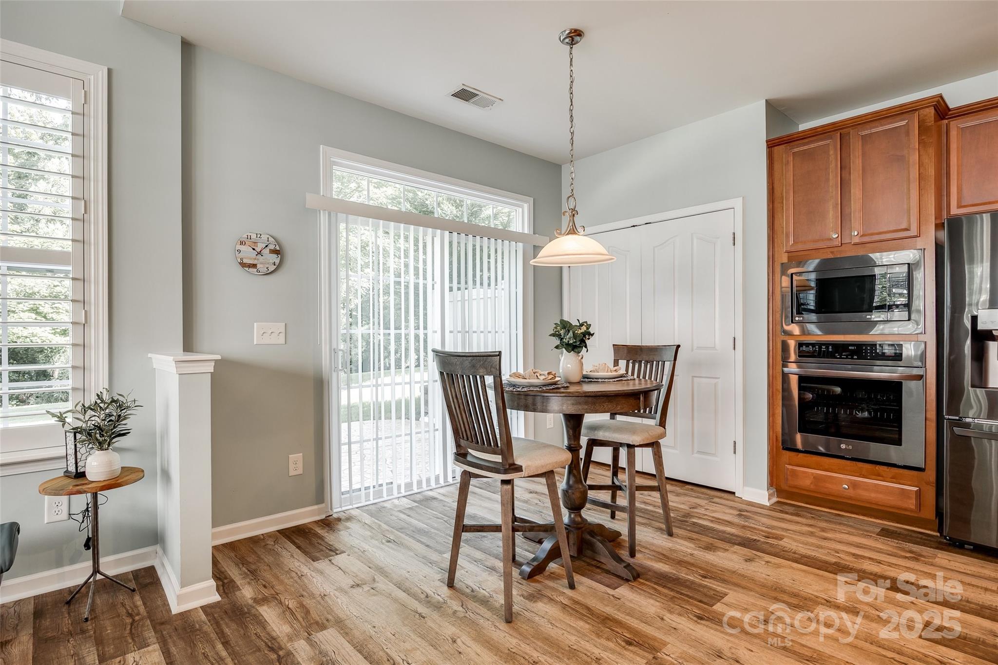 714 Deerbrook Lane Tega Cay, SC 29708 - Photo 13 of 35 a view of a dining room with furniture window and wooden floor