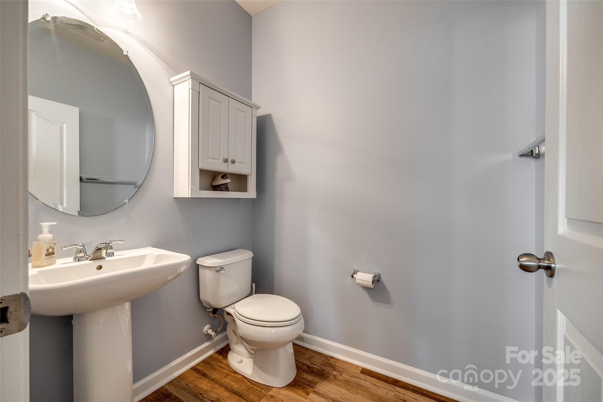 714 Deerbrook Lane Tega Cay, SC 29708 - Photo 16 of 35 a bathroom with a toilet sink and mirror