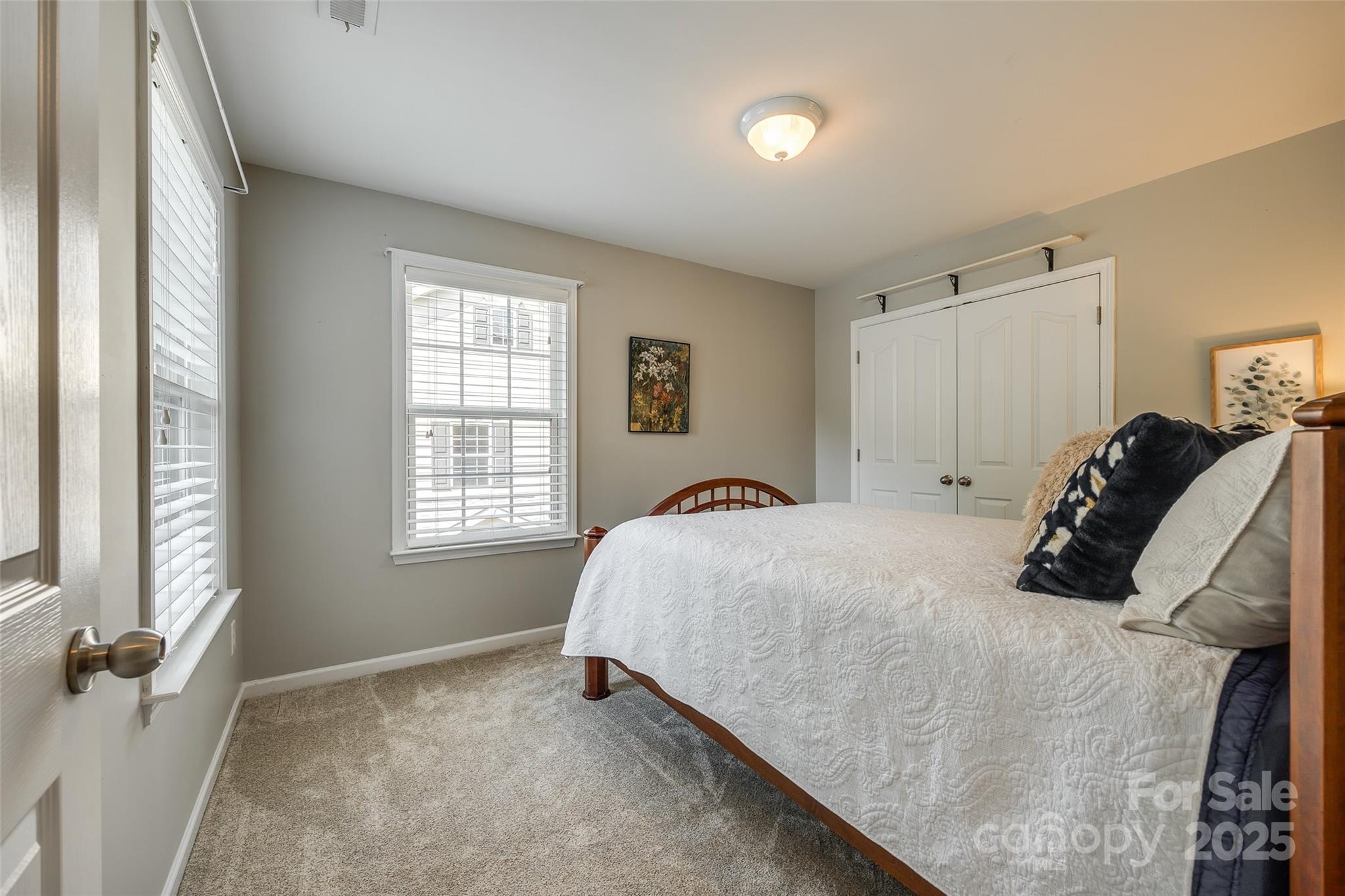 714 Deerbrook Lane Tega Cay, SC 29708 - Photo 20 of 35 a bedroom with a bed and a window