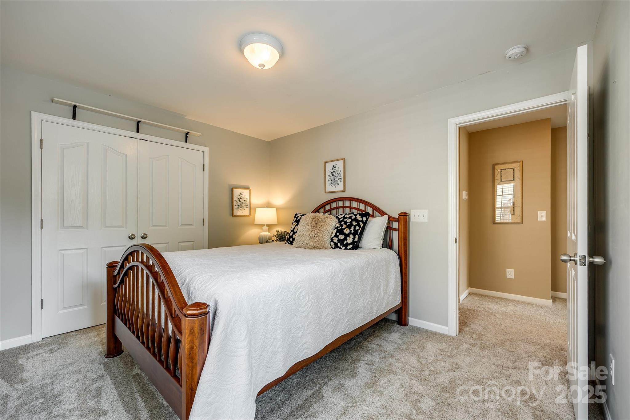 714 Deerbrook Lane Tega Cay, SC 29708 - Photo 21 of 35 a bedroom with a bed and wooden floor