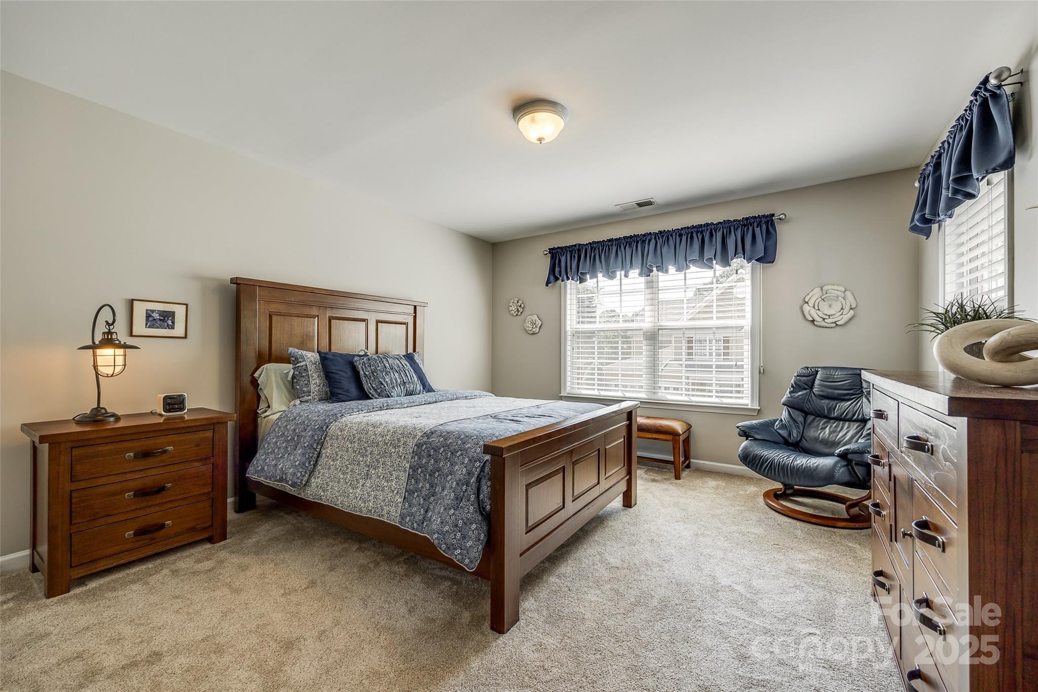 714 Deerbrook Lane Tega Cay, SC 29708 - Photo 22 of 35 a bedroom with a bed and furniture