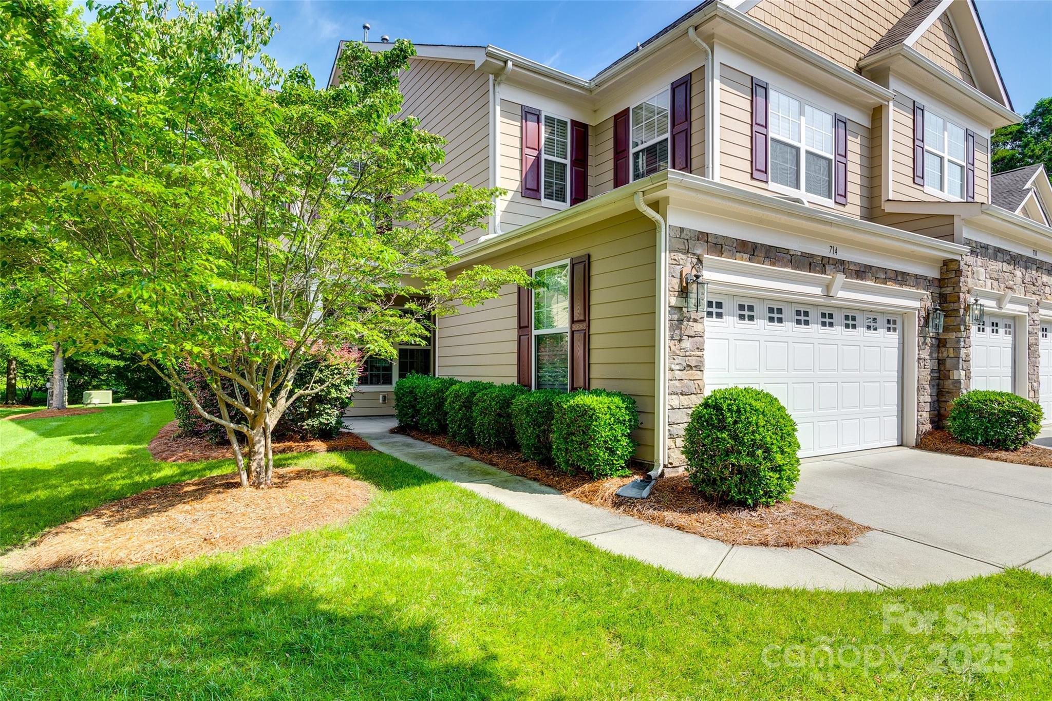 714 Deerbrook Lane Tega Cay, SC 29708 - Photo 5 of 35 a front view of a house with garden