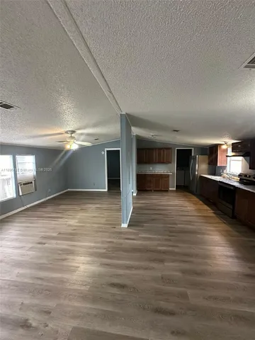 a view of a room with closet and windows