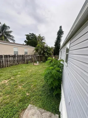 a view of a garden with a building in the background